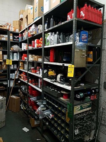Three connected shelving units and contents to