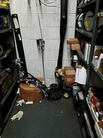 Contents of wall looks like hydraulic hoses and