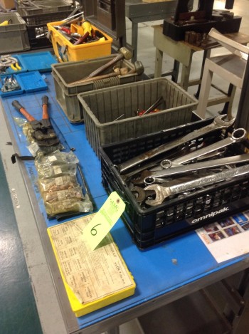 lot of plastic totes and various hand tools