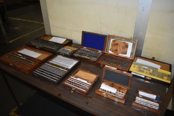 Lot of various sized Precision Gage block sets,Formica top table