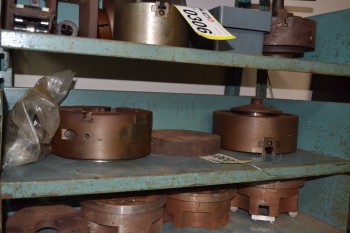 SHELF OF ASSORTED MACHINE PARTS