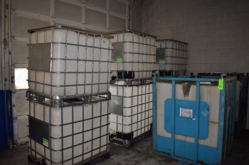 Lot of (8) Plasctic IBC Totes w/ Metal Cage Protectors