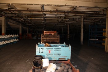 Row of pipe fittings with baskets and bins